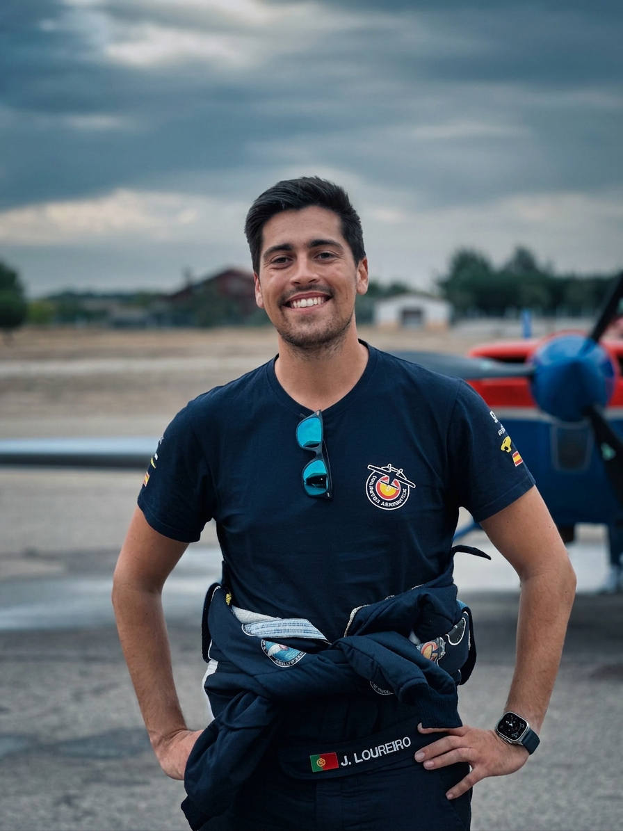 Jorge Loureiro standing beside his aerobatic aircraft