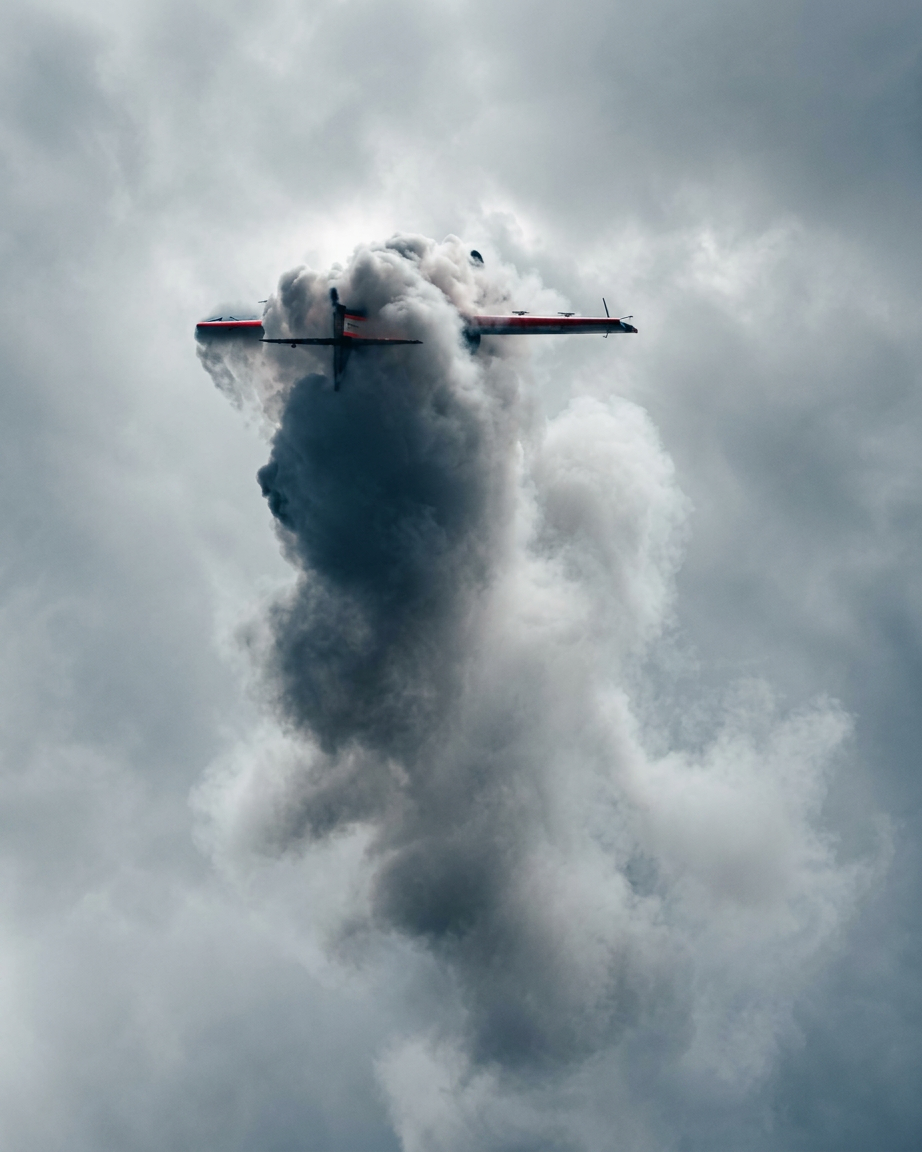 Aircraft punching through a wall of smoke