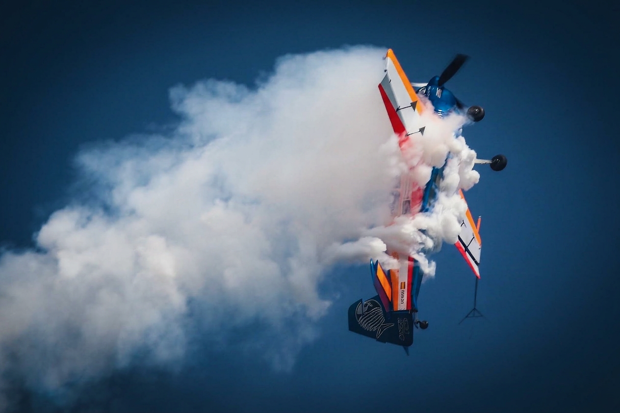 Inverted smoke pull against blue sky